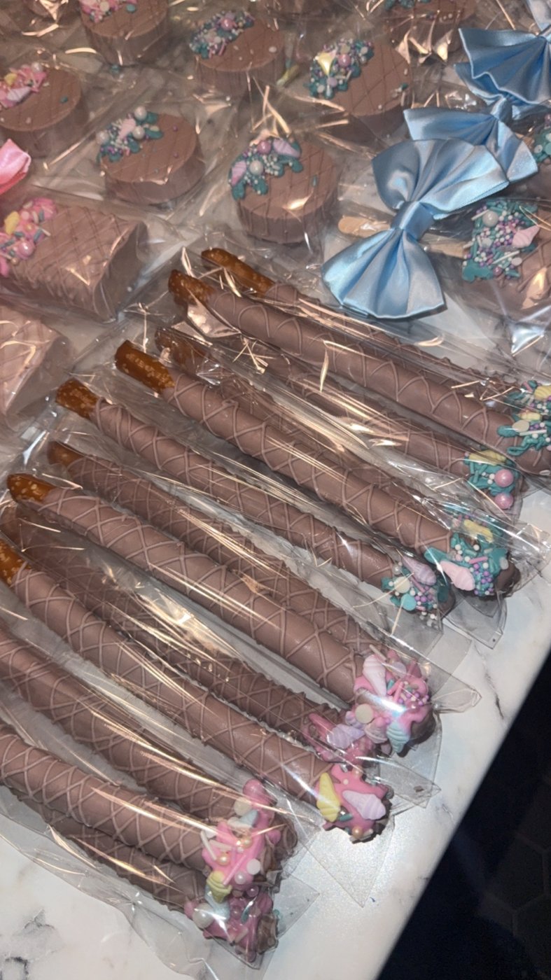 Chocolate covered pretzel rods with mermaid sprinkles