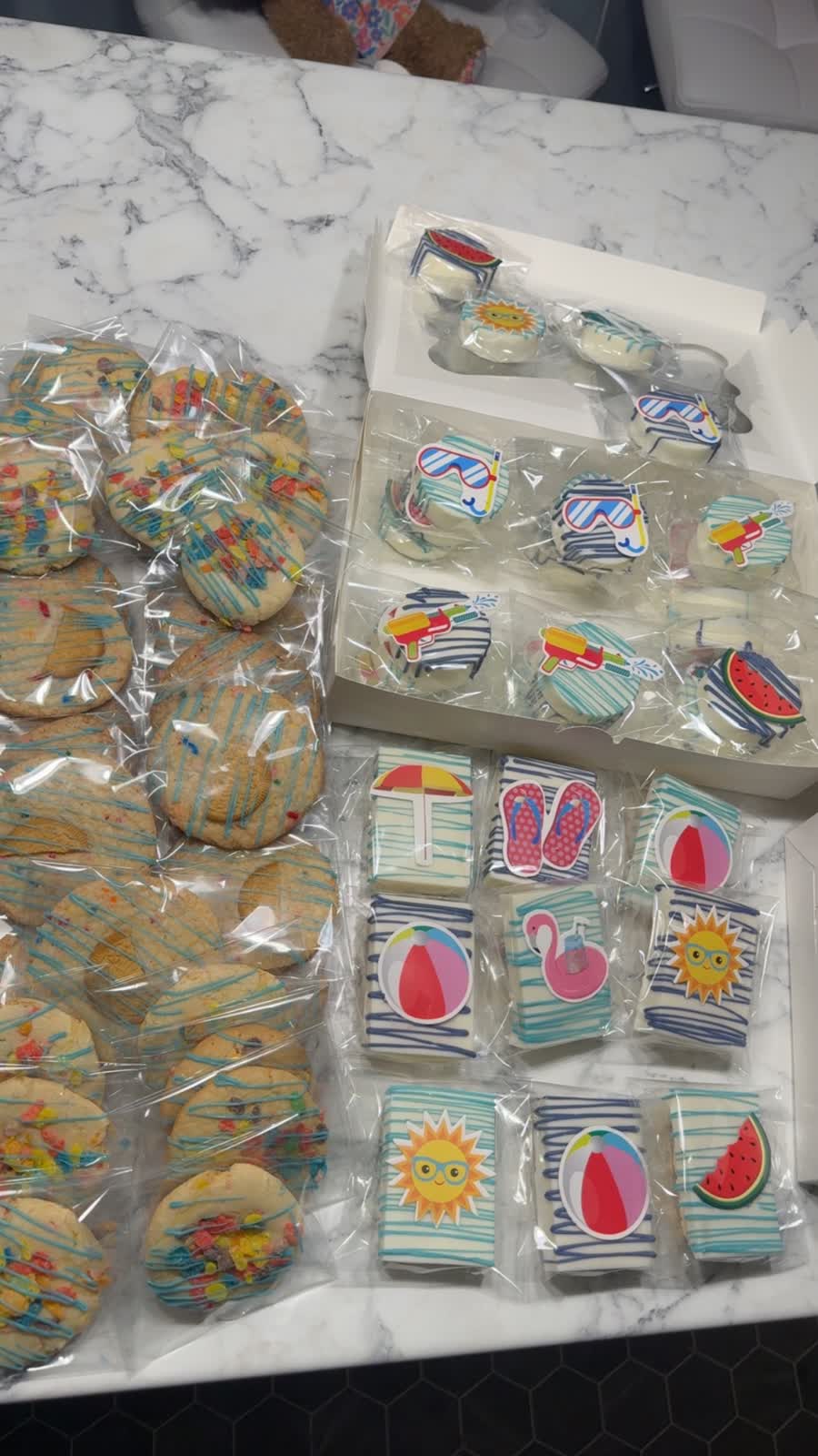 Summer-themed cookies and covered Oreos